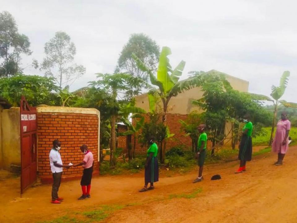 Children standing outside school in a line